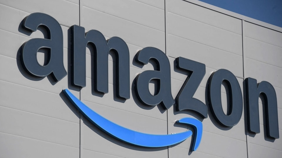 (FILES) In this file photo taken on September 23, 2021, the US giant Amazon logo is pictured on the opening day of a new distribution center in Augny, near Metz, eastern France. - Amazon announced on January 4, 2023 it will cut more than 18,000 jobs from its workforce, citing 