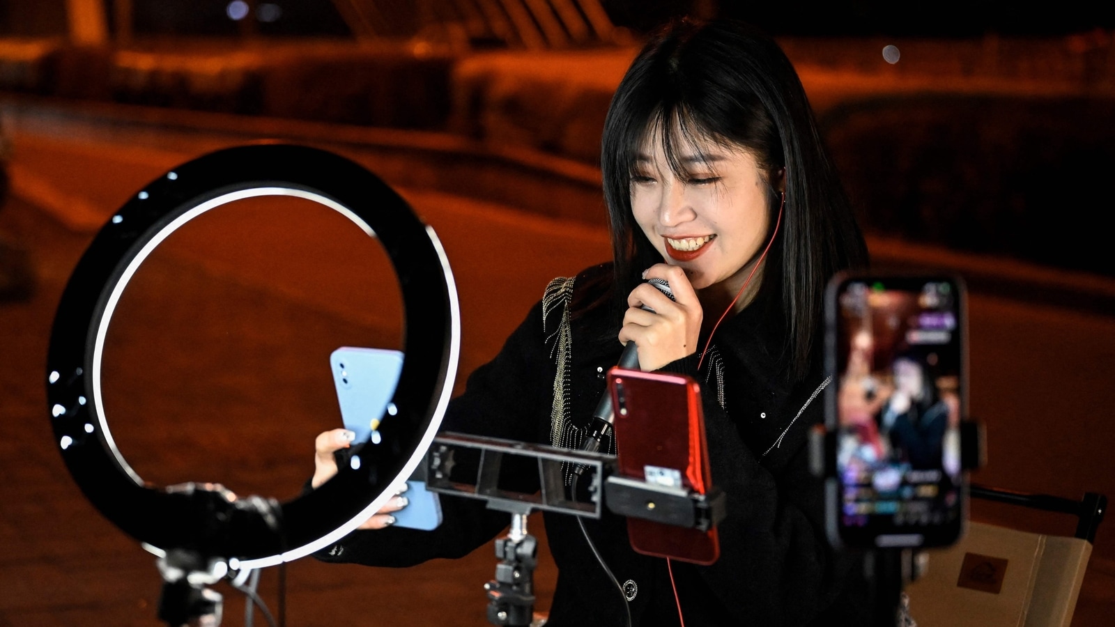 The broadcasters gather in spots like this in the city of Guilin most nights in hope of standing out to users scrolling through reams of livestreams. Chinese livestreamers