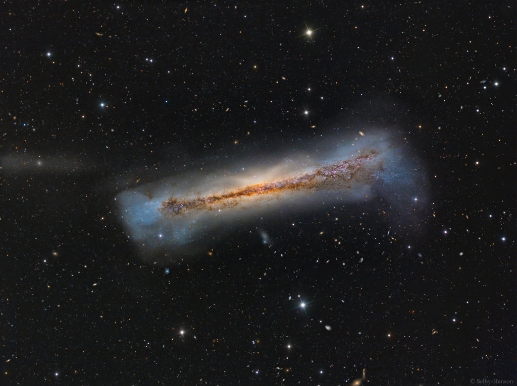 Fascinating Hamburger Galaxy (April 14) - It is a fascinating snapshot of NGC 3628, also known as the Hamburger Galaxy. It is a spiral galaxy located about 35 million light-years away towards the constellation of Leo and spans about 100,000 light-years. According to NASA, NGC 3628 shares its neighborhood in the local Universe with two other large spirals M65 and M66 in a grouping otherwise known as the Leo Triplet. Spiral Galaxy