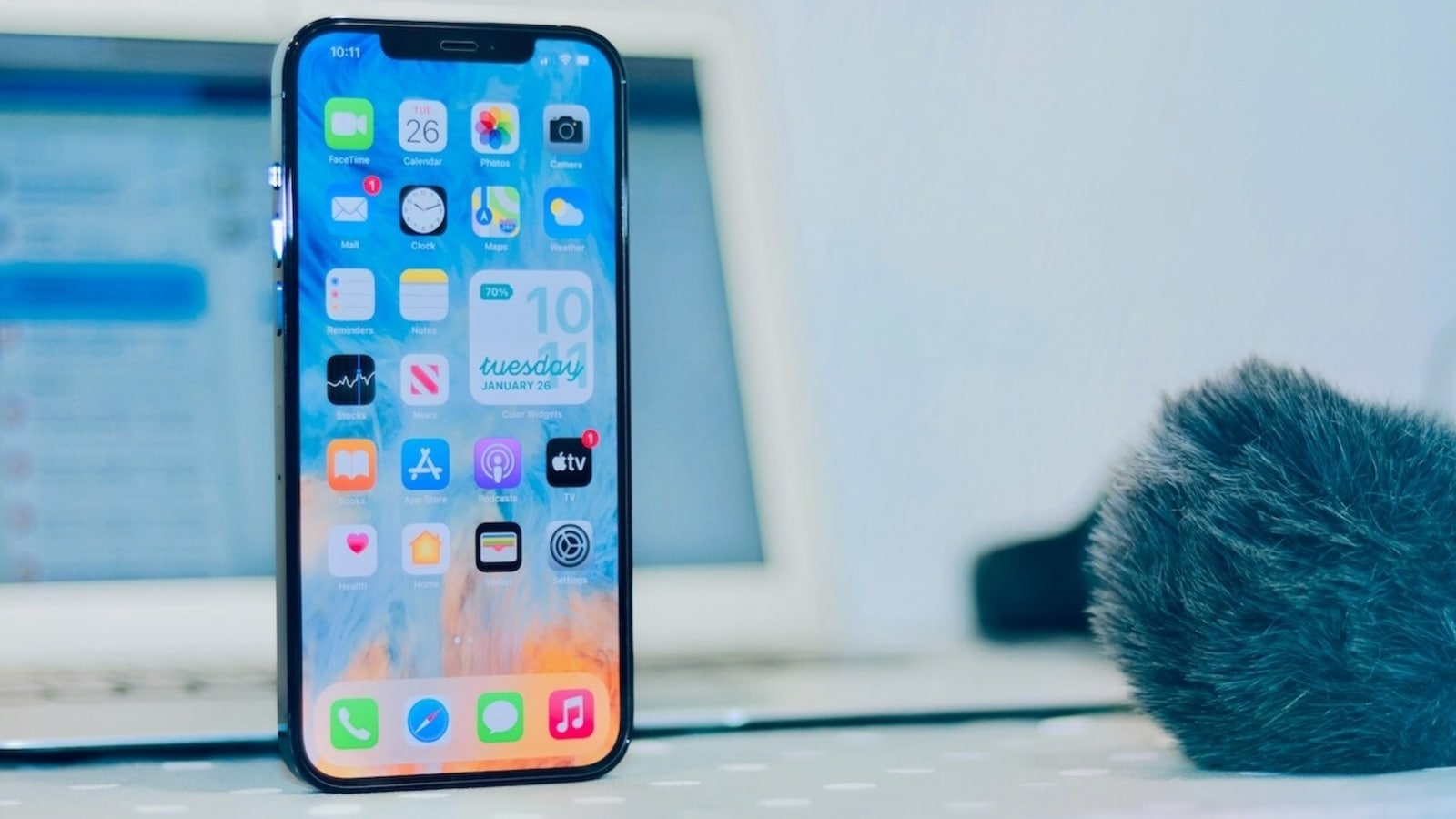 iPhone 12 features an OLED display, dual camera system, and 5G. iPhone 12