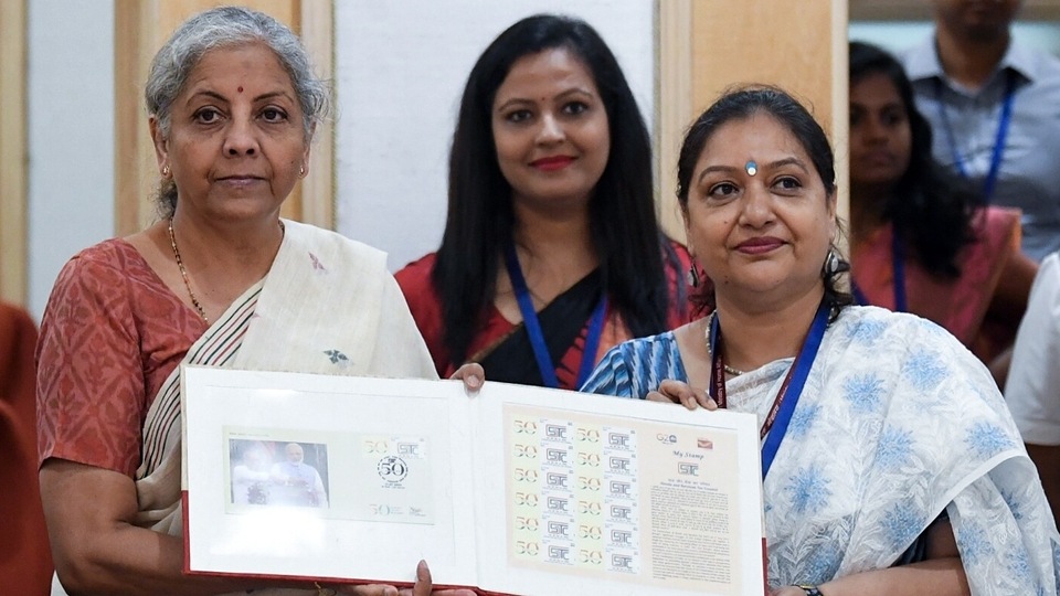 Union Finance Minister Nirmala Sitharaman releases a stamp during the 50th meeting of the GST Council, at Vigyan Bhawan in New Delhi on Tuesday. GST Council meeting