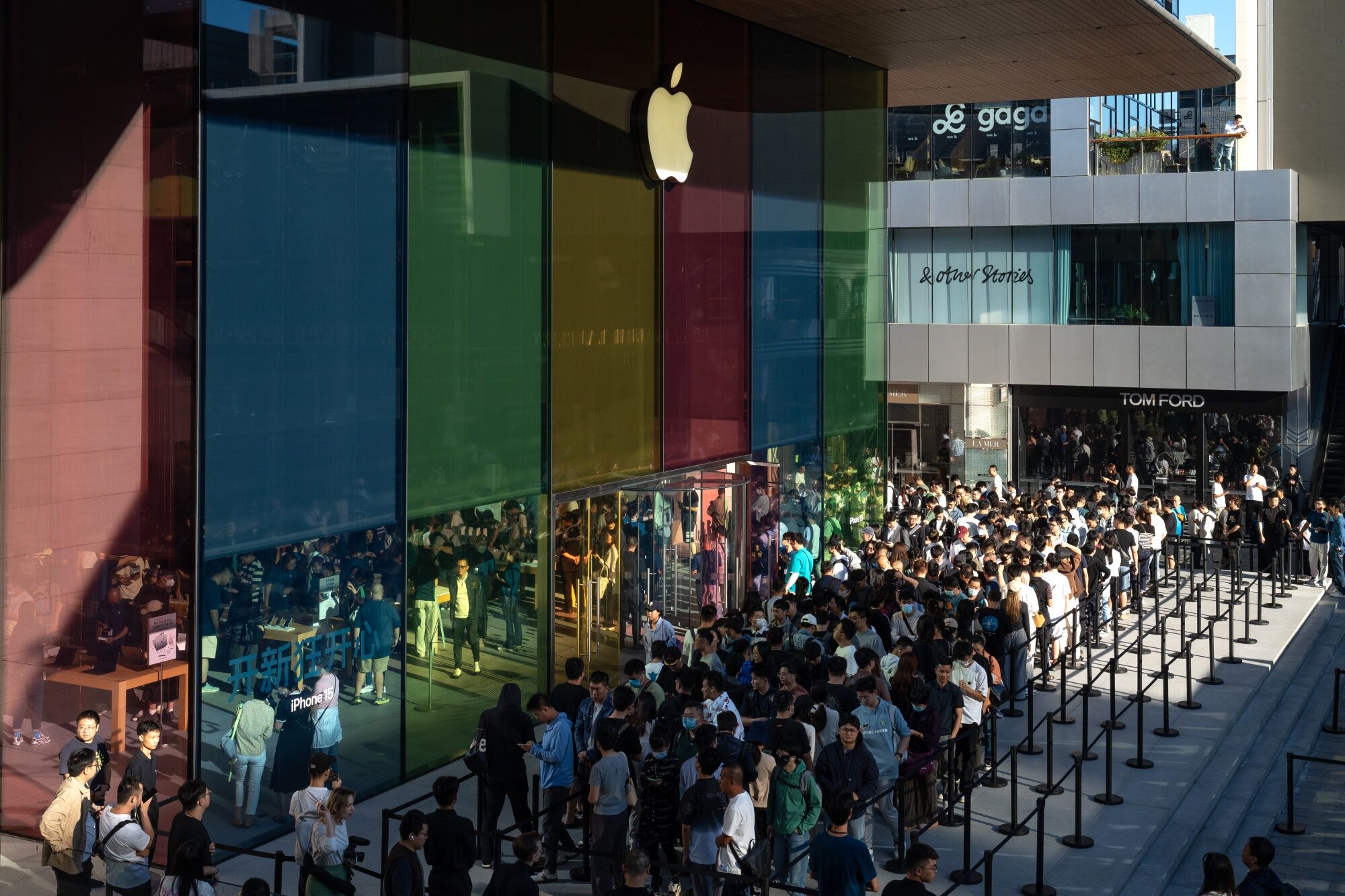Customers queue outside an Apple Inc. store during the first day of sale of the iPhone 15 smartphone in Beijing, China, on Friday, Sept. 22, 2023. Apple's latest iPhones and watches went on sale today, a test of whether a new smartphone design and modest smartwatch changes can help return the company to growth. Photographer: Andrea Verdelli/Bloomberg Customers queue outside an Apple Inc. store during the first day of sale of the iPhone 15 smartphone in Beijing, China, on Friday, Sept. 22, 2023. Apple's latest iPhones and watches went on sale today, a test of whether a new smartphone design and modest smartwatch changes can help return the company to growth. Photographer: Andrea Verdelli/Bloomberg