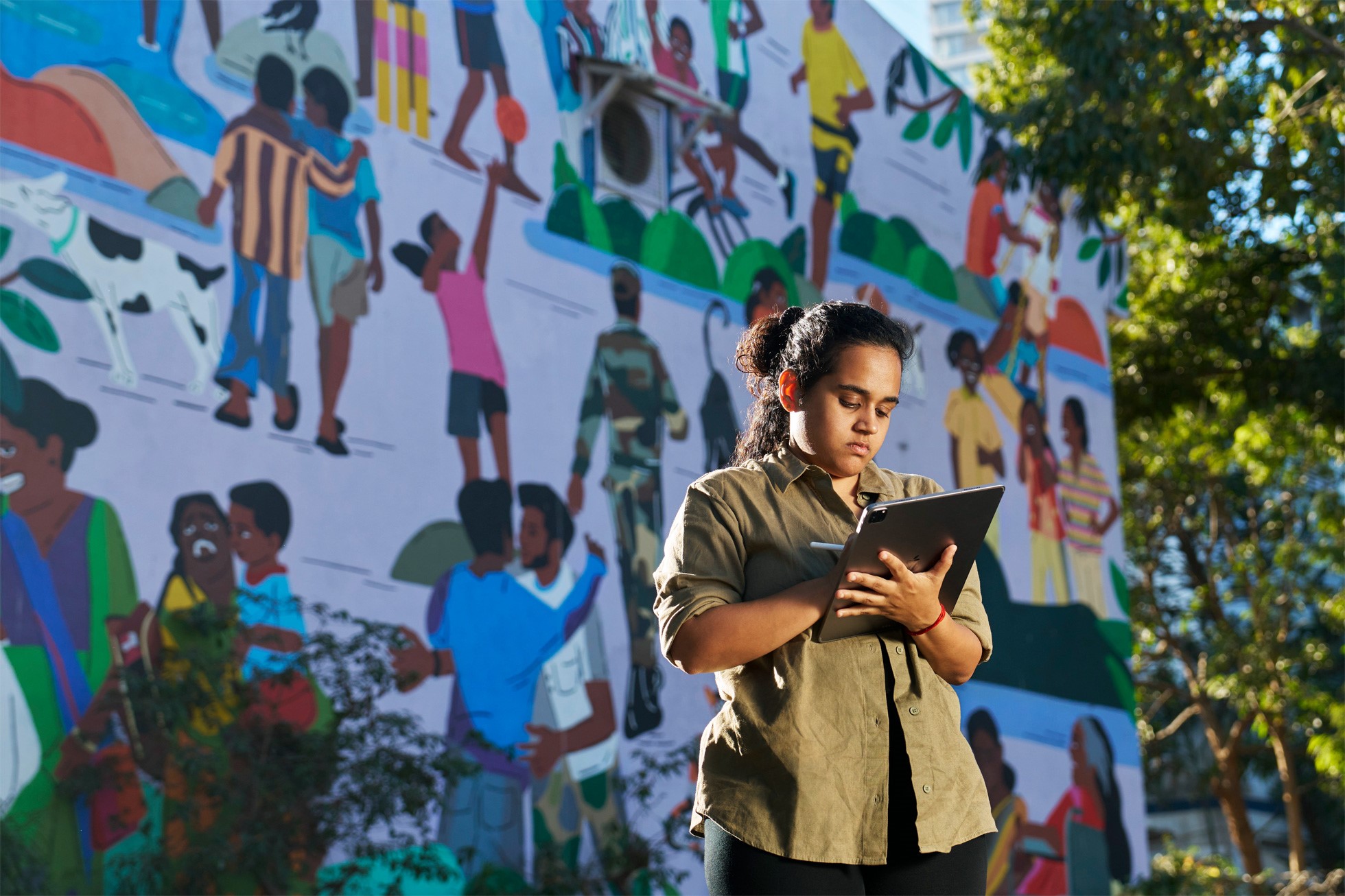 Muralist and illustrator Sadhna Prasad is using Procreate and Procreate Dreams on iPad Pro to create a large-scale mural called I’ll Be Back. Apple