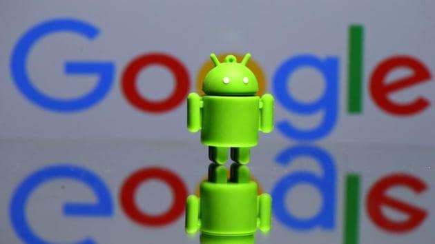 A 3D printed Android mascot Bugdroid is seen in front of a Google logo in this illustration taken on July 9.