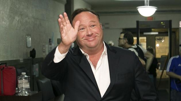 Twitter says it is suspending the account of the far-right conspiracy theorist Alex Jones for one week after he violated the company’s rules against inciting violence.