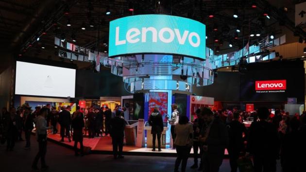 FILE PHOTO: Visitors attend the Lenovo booth at the Mobile World Congress in Barcelona, Spain, February 26, 2018. REUTERS/Sergio Perez