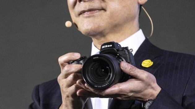 Kazuo Ushida, president of Nikon Corp., holds a Nikon Z7, the company's new mirrorless digital camera, during a news conference lunching it in Tokyo, Japan on Thursday August 23, 2018.