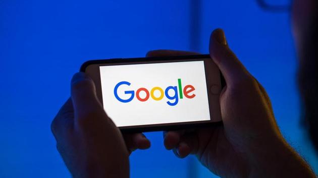 The logo of Google, a unit of Alphabet Inc., sits on an Apple Inc. iPhone smartphone in this arranged photograph in London, U.K., on Monday, Aug. 20, 2018.