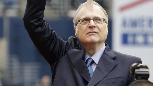 Seattle Seahawks owner Paul Allen waves as he is honoured for his 20 years of team ownership before an NFL football game against the San Francisco 49ers in Seattle.