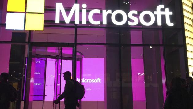 FILE - In this Nov. 10, 2016, file photo, people walk near a Microsoft office in New York. Consumer advocates and the data-hungry technology industry are drawing early battle lines in 2019 in advance of an expected fight over a national privacy law. A think tank backed by Google, Amazon, Microsoft and other major tech companies proposed changes that would still give the industry broad authority to collect and use customer data.