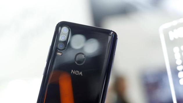 A person holds a NOA f10 smartphone at the Mobile World Congress (MWC) in Barcelona on February 28, 2019. - Phone makers will focus on foldable screens and the introduction of blazing fast 5G wireless networks at the world's biggest mobile fair as they try to reverse a decline in sales of smartphones.