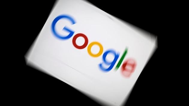 (FILES) In this file photo taken on February 04, 2019 A picture taken on February 5, 2019 shows the Google logo displayed on a tablet in Paris. - Google on April 4, 2019, confirmed that it has disbanded a recently assembled artificial intelligence ethics advisory panel in the face of controversy over its membership. The end of the Advanced Technology External Advisory Council (ATEAC) came just days after a group of Google employees launched a public campaign against having the president of conservative think-tank Heritage Foundation among its members. (Photo by Lionel BONAVENTURE / AFP)