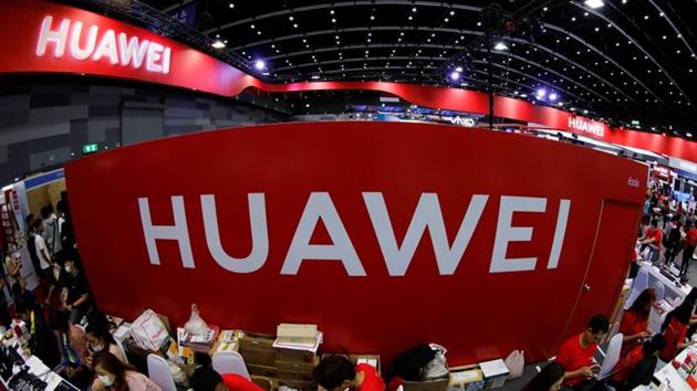 Workers sit at the Huawei stand at the Mobile Expo in Bangkok, Thailand, May 31, 2019.