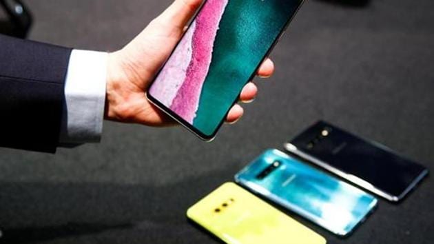 A journalist holds the new Samsung Galaxy S10 smartphone at a press event in London, Britain February 20, 2019.
