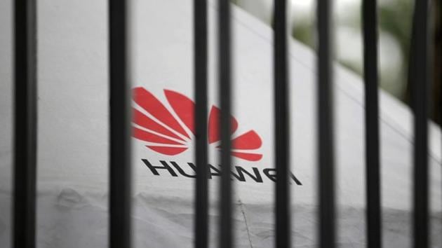 A Huawei logo is seen outside the fence at its headquarters in Shenzhen, Guangdong province, China May 29, 2019.