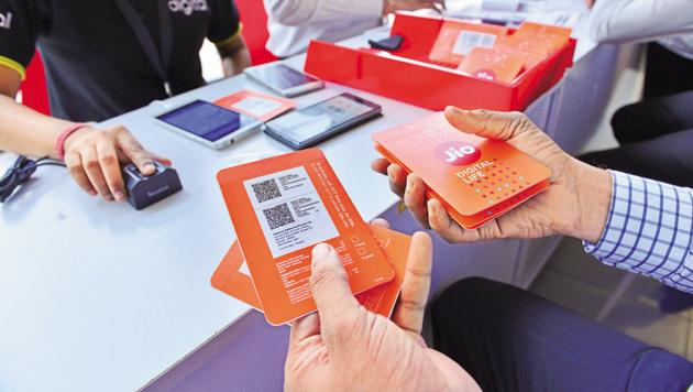 Customers buying Reliance Jio sims at a Reliance Digital centre in Mumbai.