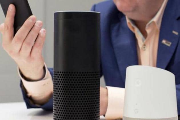 Amazon Echo, center, and a Google Home, right, are displayed in New York.