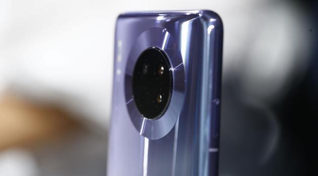 A quad-camera lens array sits on the back of a Huawei Technologies Co. Mate 30 smartphone during the device's unveiling in Munich, Germany, on Thursday, Sept. 19, 2019.