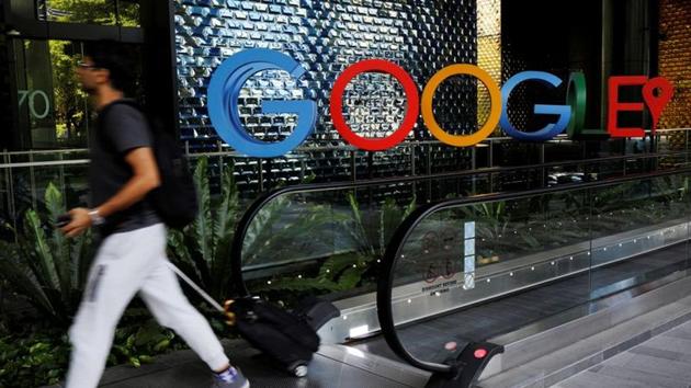 A man passes a Google signage outside their office in Singapore May 24, 2019.