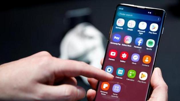 A journalist uses the Samsung Galaxy S10 smartphone at a press event in London, Britain February 20, 2019.