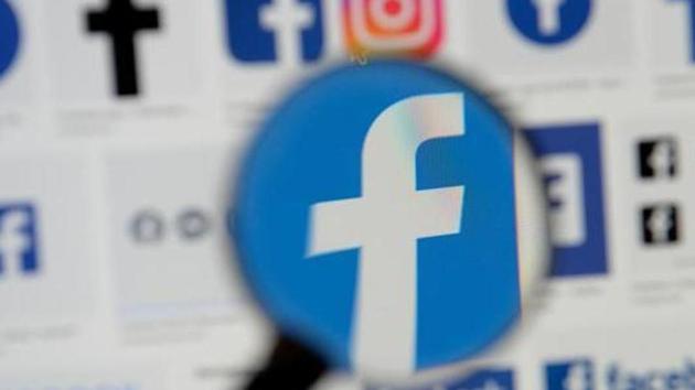 Facebook logos are seen on a screen in this picture illustration taken December 2, 2019.