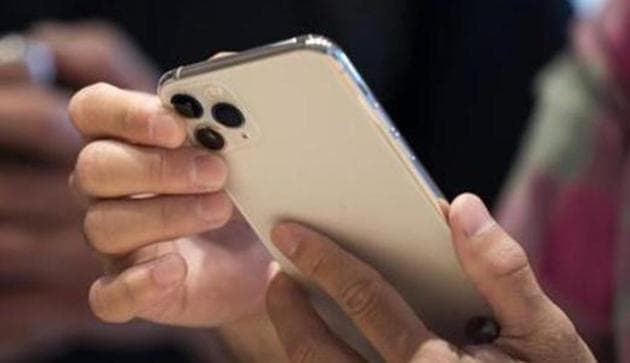 A customer tries an iPhone 11 Pro Max in the Apple Marunouchi store on September 20, 2019 in Tokyo, Japan.