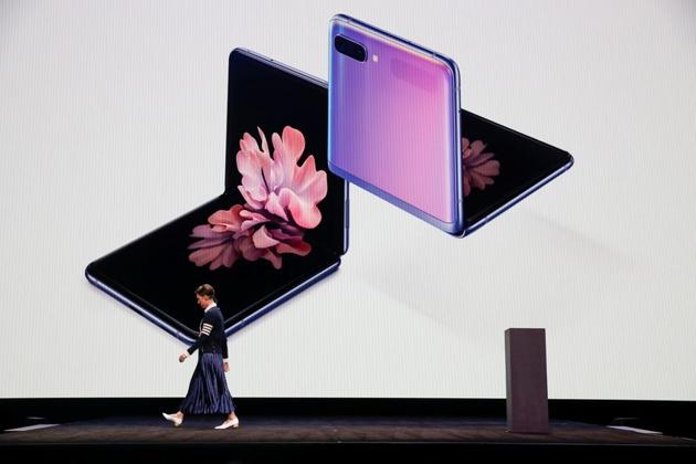 Rebecca Hirst, head of UK product marketing of Samsung Electronics, unveils the Z Flip foldable smartphone during Samsung Galaxy Unpacked 2020 in San Francisco, California, U.S