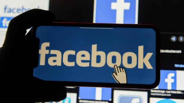 FILE PHOTO: The Facebook logo is displayed on a mobile phone in this picture illustration taken December 2, 2019.