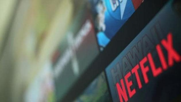 The Netflix logo is pictured on a television in this illustration photograph taken in Encinitas, California, US.