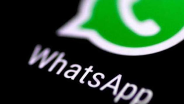 The WhatsApp messaging application is seen on a phone screen.