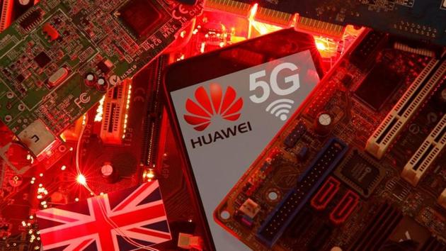 FILE PHOTO: The British flag and a smartphone with a Huawei and 5G network logo are seen on a PC motherboard in this illustration picture taken January 29, 2020.