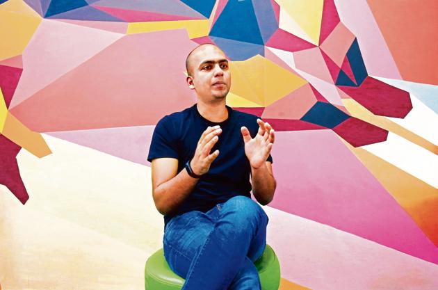 Manu Kumar Jain, Managing Director of Xiaomi India, gestures as he speaks during an interview with Reuters inside his office in Bengaluru, India, January 18, 2018. Picture taken January 18, 2018. REUTERS/Abhishek N. Chinnappa - RC1532824B60