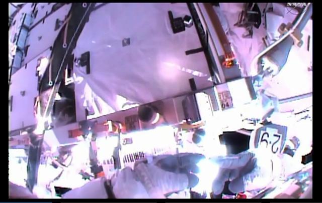 This NASA TV image obtained November 6, 2015 shows astronaut Scott Kelly as he points to a thread on his glove. This NASA TV image obtained November 6, 2015 shows astronaut Scott Kelly as he points to a thread on his glove.