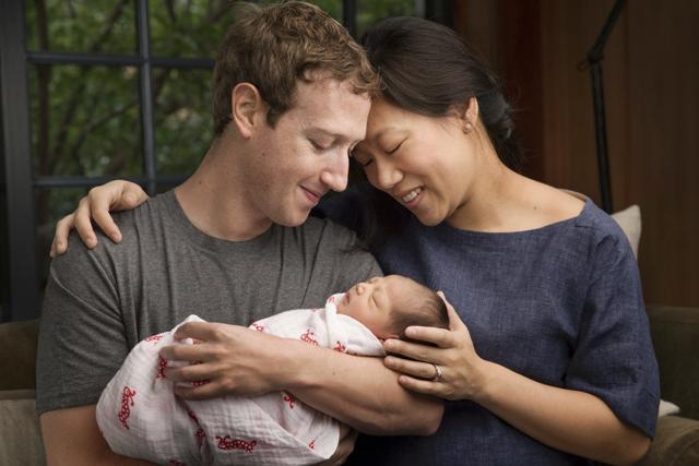 In this undated photo provided by Mark Zuckerberg, Max Chan Zuckerberg is held by her parents, Mark Zuckerberg and Priscilla Chan Zuckerberg. In this undated photo provided by Mark Zuckerberg, Max Chan Zuckerberg is held by her parents, Mark Zuckerberg and Priscilla Chan Zuckerberg.