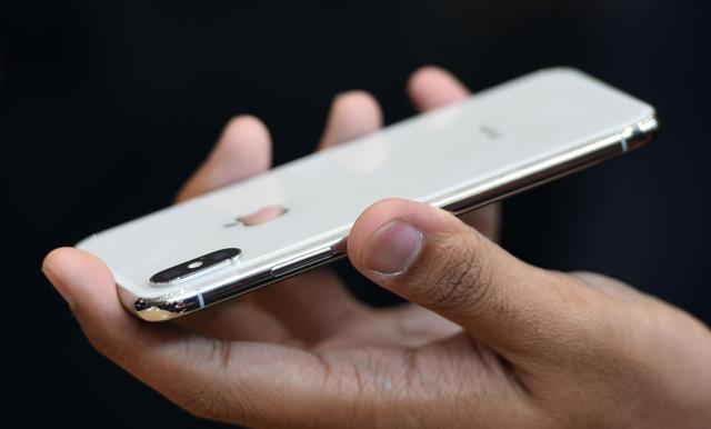 People try out the new iPhone X during a media event at Apple's new headquarters in Cupertino, California. People try out the new iPhone X during a media event at Apple's new headquarters in Cupertino, California.