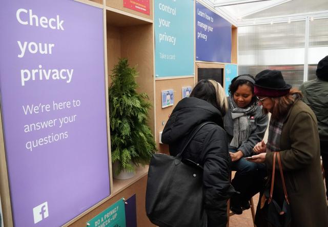 Facebook employees talks to visitors as the social network Facebook opens a pop-up kiosk for one day on December 13, 2018, in Bryant Park in New York, where it will field questions about its data-sharing practices and teach users how to understand its new privacy controls. Facebook employees talks to visitors as the social network Facebook opens a pop-up kiosk for one day on December 13, 2018, in Bryant Park in New York, where it will field questions about its data-sharing practices and teach users how to understand its new privacy controls.
