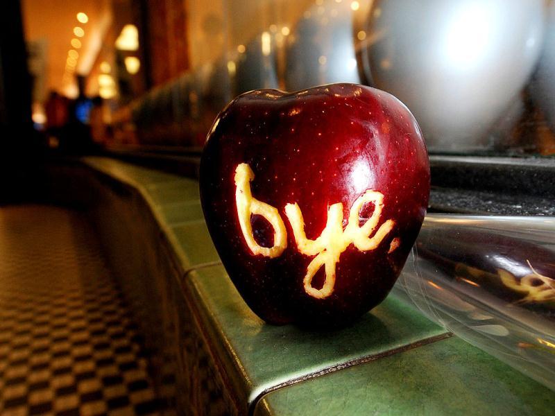 A apple with the word 'bye' carved into it sits outside an Apple store after it was left by a man commemorating the life of Steve Jobs in Pasadena, California. A apple with the word 'bye' carved into it sits outside an Apple store after it was left by a man commemorating the life of Steve Jobs in Pasadena, California.