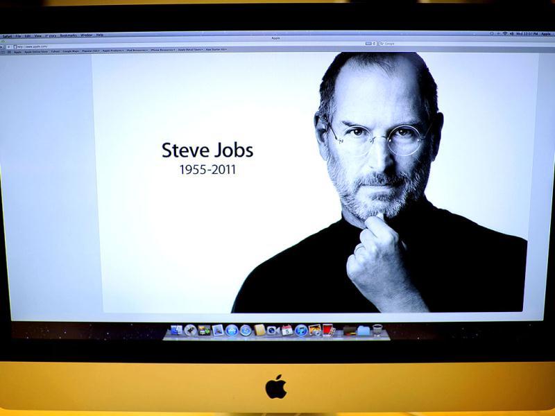 A photo of Steve Jobs stands on a computer at Apple's flagship store on New York's 5th Avenue. A photo of Steve Jobs stands on a computer at Apple's flagship store on New York's 5th Avenue.