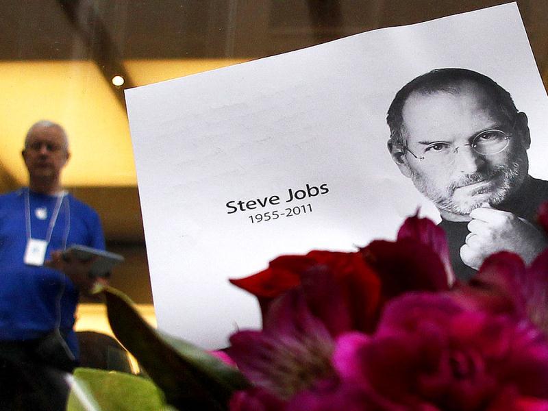 Flowers in memory of Steve Jobs are seen outside an Apple Store in central Sydney. Flowers in memory of Steve Jobs are seen outside an Apple Store in central Sydney.