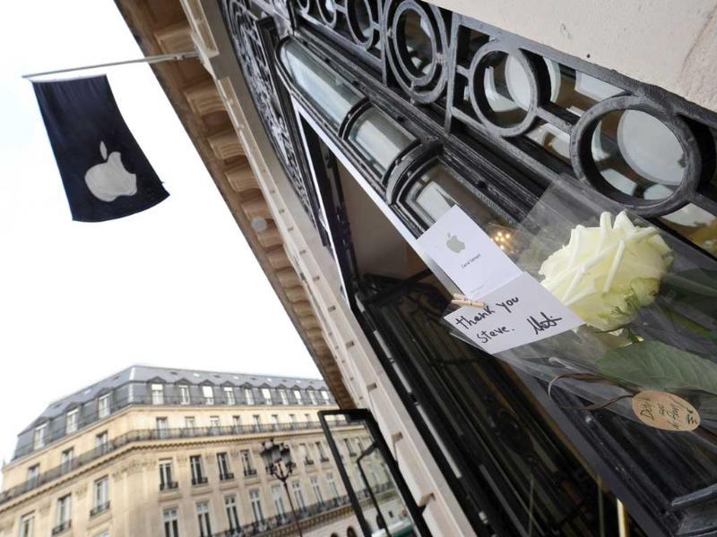 A rose and a message reading Thank you Steve are display at the entrance of an Apple store on October 6 in Paris. A rose and a message reading Thank you Steve are display at the entrance of an Apple store on October 6 in Paris.