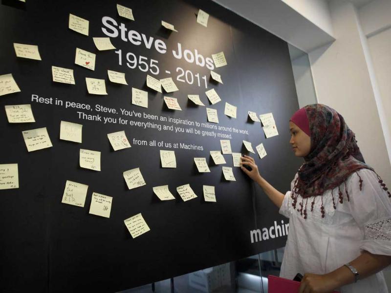 A Malaysian reads condolent notes to pay tribute to Steve Jobs, the Apple founder and former CEO, at an Apple computer outlet in Kuala Lumpur, Malaysia. A Malaysian reads condolent notes to pay tribute to Steve Jobs, the Apple founder and former CEO, at an Apple computer outlet in Kuala Lumpur, Malaysia.