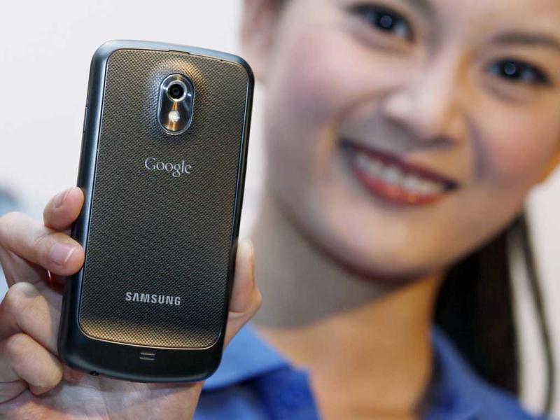 A model displays the new Galaxy Nexus smartphone, the first to use the latest - Ice Cream Sandwich - version of Google's Android operating system, during a news conference in Hong Kong. A model displays the new Galaxy Nexus smartphone, the first to use the latest - Ice Cream Sandwich - version of Google's Android operating system, during a news conference in Hong Kong.