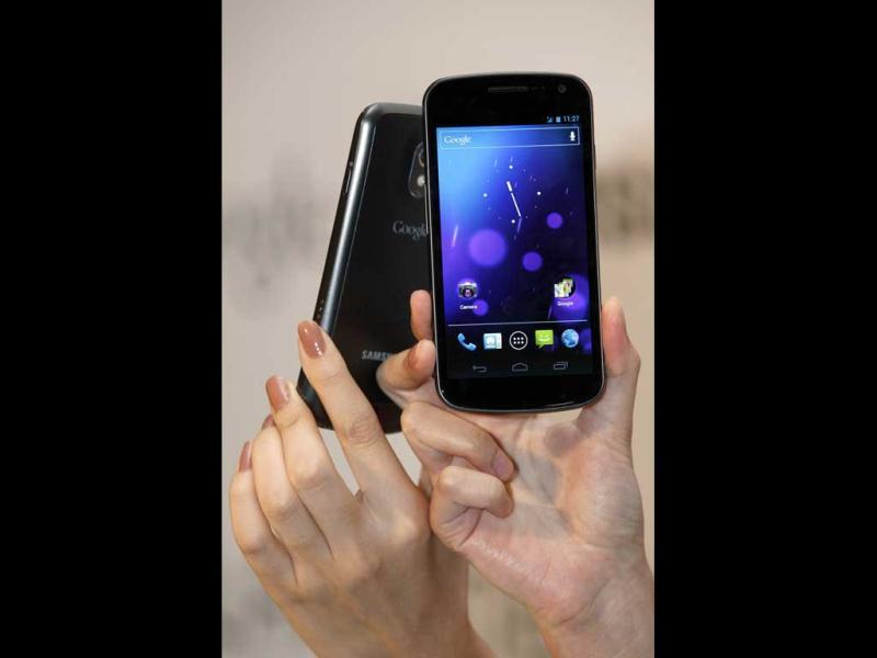 Models display the new Galaxy Nexus smartphone during a news conference in Hong Kong. South Korea's Samsung Electronics Co. Ltd on Wednesday unveiled its Galaxy Nexus smartphone, the first to use the latest version of Google's Android operating system. Models display the new Galaxy Nexus smartphone during a news conference in Hong Kong. South Korea's Samsung Electronics Co. Ltd on Wednesday unveiled its Galaxy Nexus smartphone, the first to use the latest version of Google's Android operating system.