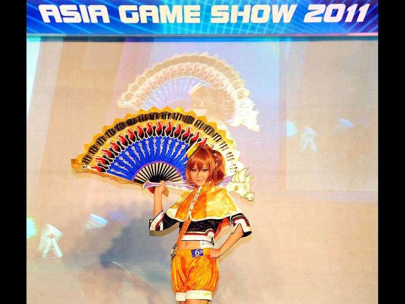 A girl dressed in cosplay strikes a pose during the 10th Asia Game Show 2011 in Hong Kong. Cosplay, short for 'costume play', is a type of performance art in which participants don costumes and accessories to represent a specific character or idea, often drawn from popular fiction in Japan. (AFP Photo/Laurent Fievet) A girl dressed in cosplay strikes a pose during the 10th Asia Game Show 2011 in Hong Kong. Cosplay, short for 'costume play', is a type of performance art in which participants don costumes and accessories to represent a specific character or idea, often drawn from popular fiction in Japan. (AFP Photo/Laurent Fievet)