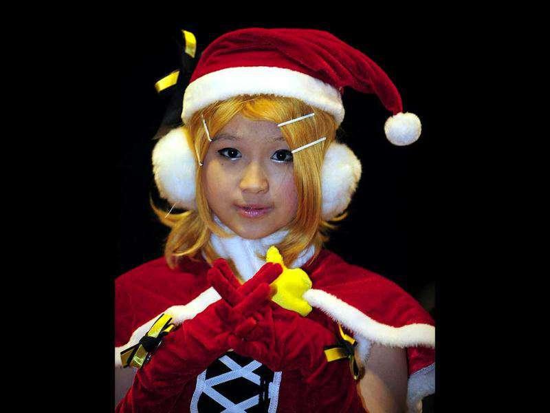 A girl dressed in cosplay poses during the 10th Asia Game Show 2011 in Hong Kong. Cosplay, short for 'costume play', is a type of performance art in which participants don costumes and accessories to represent a specific character or idea, often drawn from popular fiction in Japan. (AFP Photo/Laurent Fievet) A girl dressed in cosplay poses during the 10th Asia Game Show 2011 in Hong Kong. Cosplay, short for 'costume play', is a type of performance art in which participants don costumes and accessories to represent a specific character or idea, often drawn from popular fiction in Japan. (AFP Photo/Laurent Fievet)