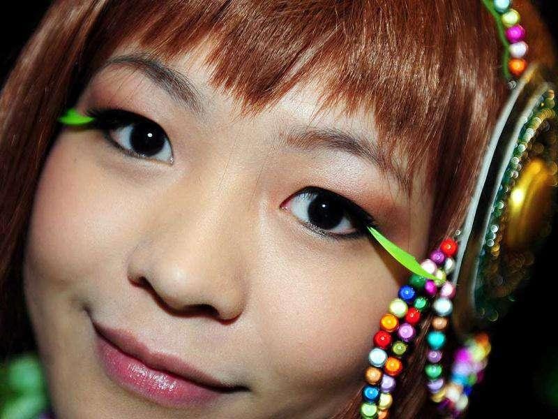 A girl dressed in cosplay poses during the 10th Asia Game Show 2011 in Hong Kong. Cosplay, short for 'costume play', is a type of performance art in which participants don costumes and accessories to represent a specific character or idea, often drawn from popular fiction in Japan. (AFP Photo/Laurent Fievet) A girl dressed in cosplay poses during the 10th Asia Game Show 2011 in Hong Kong. Cosplay, short for 'costume play', is a type of performance art in which participants don costumes and accessories to represent a specific character or idea, often drawn from popular fiction in Japan. (AFP Photo/Laurent Fievet)
