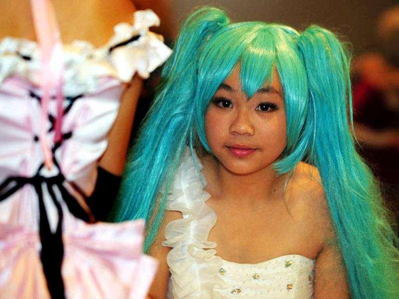 A girl dressed in cosplay poses during the 10th Asia Game Show 2011 in Hong Kong. Cosplay, short for 'costume play', is a type of performance art in which participants don costumes and accessories to represent a specific character or idea, often drawn from popular fiction in Japan. (AFP Photo/Laurent Fievet) A girl dressed in cosplay poses during the 10th Asia Game Show 2011 in Hong Kong. Cosplay, short for 'costume play', is a type of performance art in which participants don costumes and accessories to represent a specific character or idea, often drawn from popular fiction in Japan. (AFP Photo/Laurent Fievet)