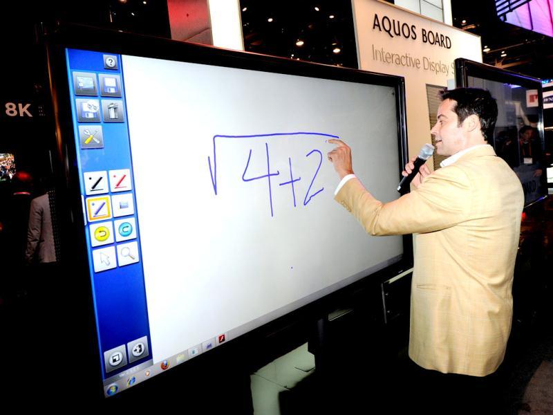 Tim Noonan demonstrates a Sharp Aquos Interactive Display System prototype on a 1080p full-HD, 70-inch LED/LCD at the Sharp Electronics booth on the opening day of the 2012 International Consumer Electronics Show in the Las Vegas. Ethan Miller/Getty Images/AFP Tim Noonan demonstrates a Sharp Aquos Interactive Display System prototype on a 1080p full-HD, 70-inch LED/LCD at the Sharp Electronics booth on the opening day of the 2012 International Consumer Electronics Show in the Las Vegas. Ethan Miller/Getty Images/AFP