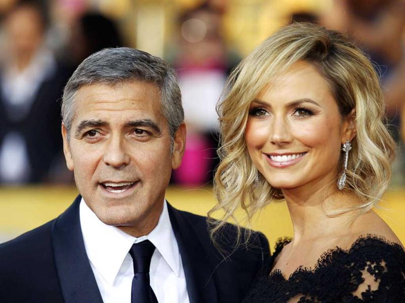 George Clooney and Stacy Keibler arrive at the awards. George Clooney and Stacy Keibler arrive at the awards.