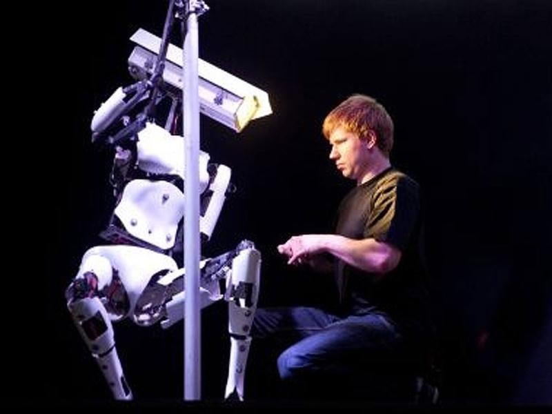 The sleek, white, life-sized humanoids, with camera-shaped lights as heads, gyrate suggestively to the music, provided by a third 'DJ' robot, with a megaphone for a head, who bops around the stage in time to the beat. ©AFP PHOTO / ODD ANDERSEN The sleek, white, life-sized humanoids, with camera-shaped lights as heads, gyrate suggestively to the music, provided by a third 'DJ' robot, with a megaphone for a head, who bops around the stage in time to the beat. ©AFP PHOTO / ODD ANDERSEN